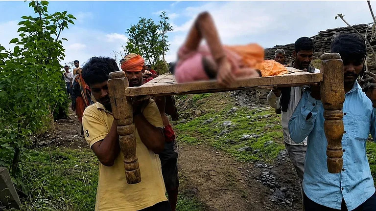 Mother gives birth while being carried across river on cot in MP village