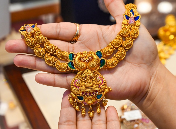 Gold, silver trade higher as weaker dollar offsets Fed rate hike fears