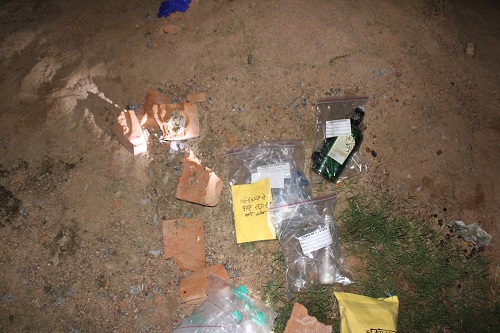 History-sheeter bludgeoned to death with a stone following a dispute during a drinking party; search underway for two suspects.